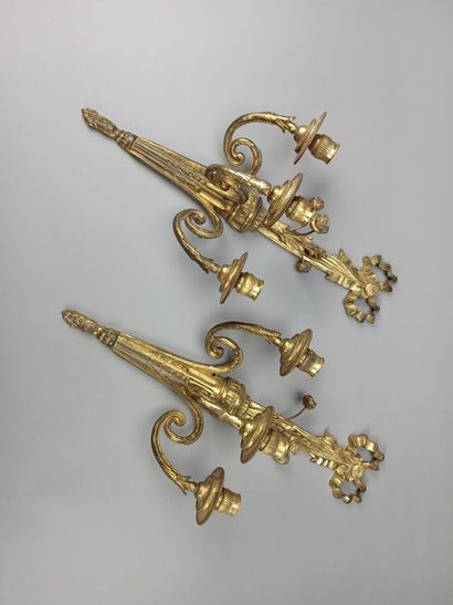 Pair of ormolu and chased sconces with three...
