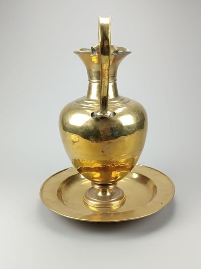 Brass ewer and basin.
The neck is outlined...