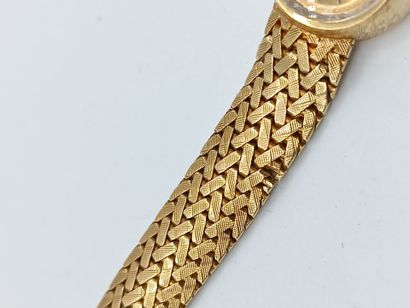 OMEGA
Montre de dame en or jaune 750°° (bracelet...