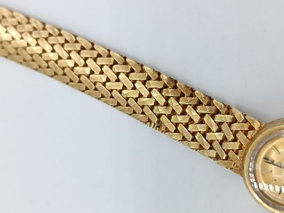 OMEGA
Montre de dame en or jaune 750°° (bracelet...