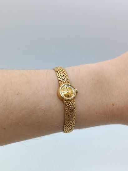 OMEGA
Montre de dame en or jaune 750°° (bracelet...