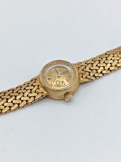 OMEGA
Montre de dame en or jaune 750°° (bracelet...