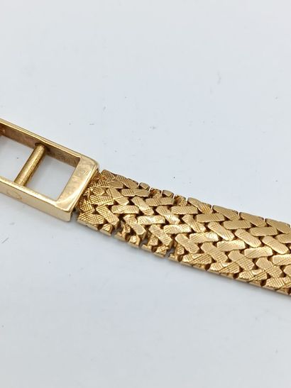 OMEGA
Montre de dame en or jaune 750°° (bracelet...
