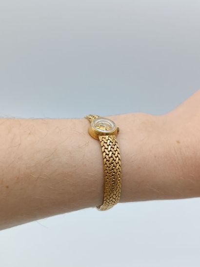 OMEGA
Montre de dame en or jaune 750°° (bracelet...