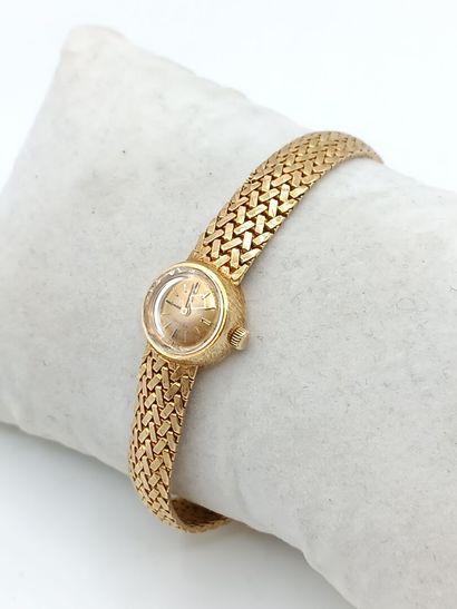 OMEGA
Montre de dame en or jaune 750°° (bracelet...