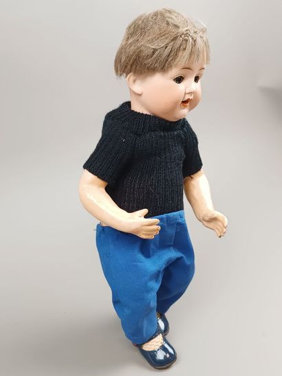 Poupée baigneur, tête en porcelaine, corps...