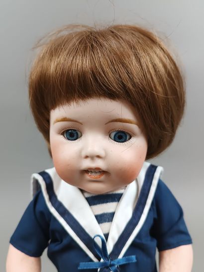 Poupée baigneur, tête en porcelaine, corps...