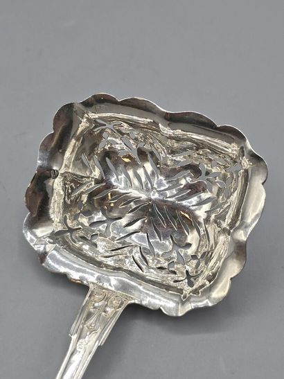 Rectangular silver sugar spoon with atypical...