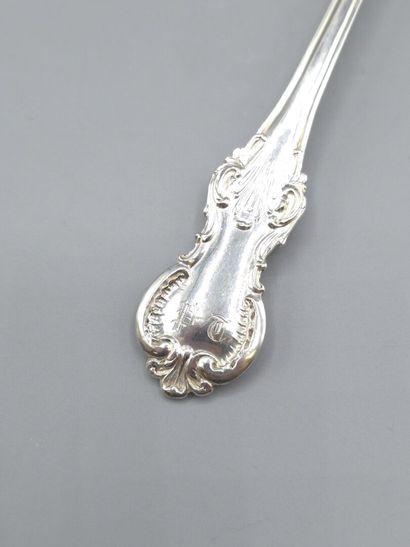 Rectangular silver sugar spoon with atypical...