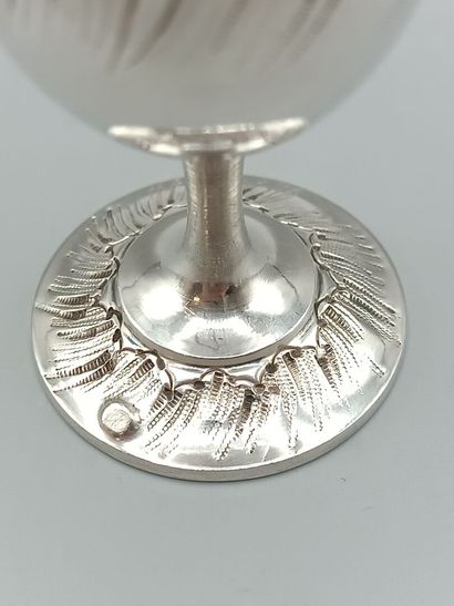 Louis XV-style silver egg cup.
Decorated...