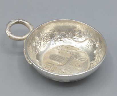 Silver wine taster with facing snake grip....