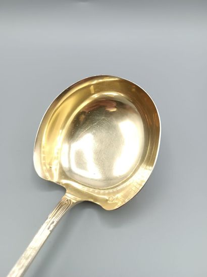 Louis XVI-style silver and vermeil soup ladle.
Decorated...