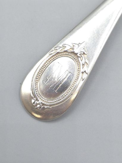 Silver strawberry scoop with scallop-shaped...
