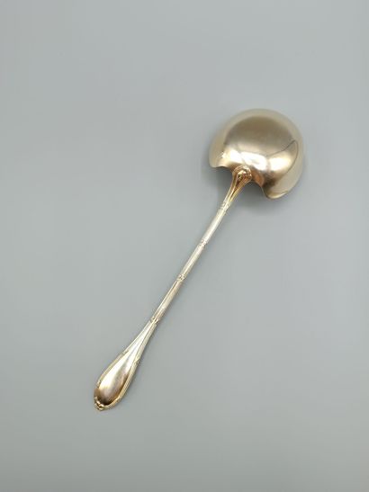 Louis XVI-style silver and vermeil soup ladle.
Decorated...