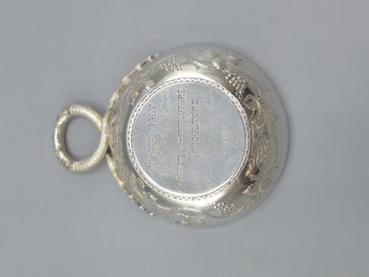 Silver wine taster with facing snake grip....