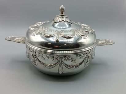 Circular silver vegetable dish in the Louis...