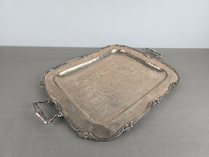 A silver tray with a curved shape.
The wing...