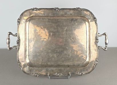 A silver tray with a curved shape.
The wing...