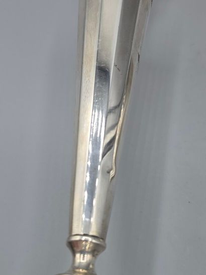 Pair of silver candlesticks.
The upper part...