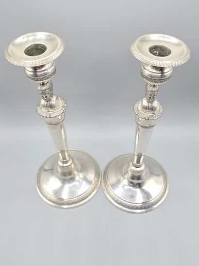 Pair of silver candlesticks.
The shafts adorned...
