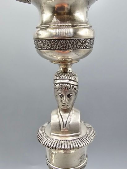 Pair of silver candlesticks.
The shafts adorned...