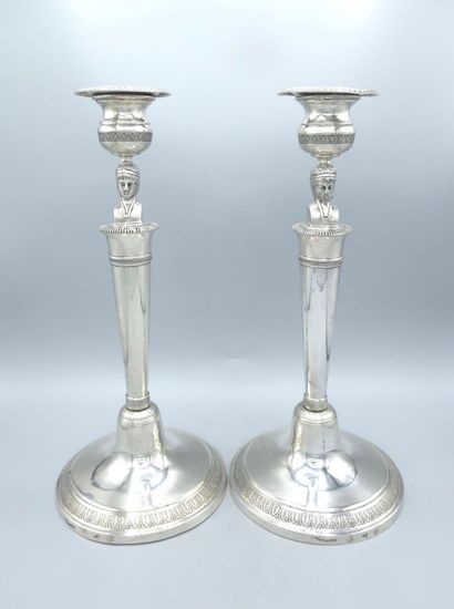 Pair of silver candlesticks.
The shafts adorned...