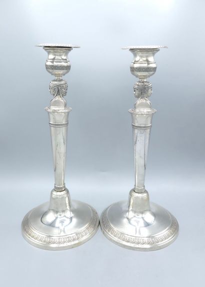Pair of silver candlesticks.
The shafts adorned...