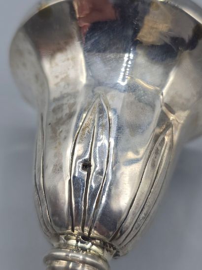 Pair of silver candlesticks.
The upper part...