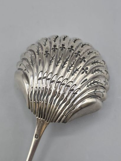 Silver spatula sugar spoon with a medallion...