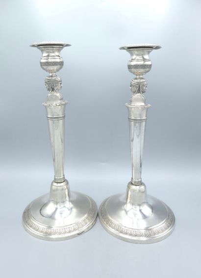Pair of silver candlesticks.
The shafts adorned...