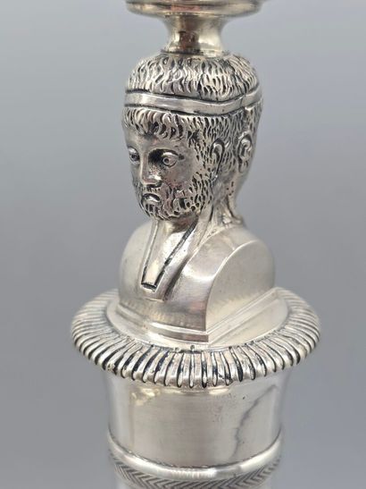 Pair of silver candlesticks.
The shafts adorned...