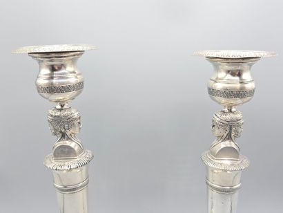 Pair of silver candlesticks.
The shafts adorned...