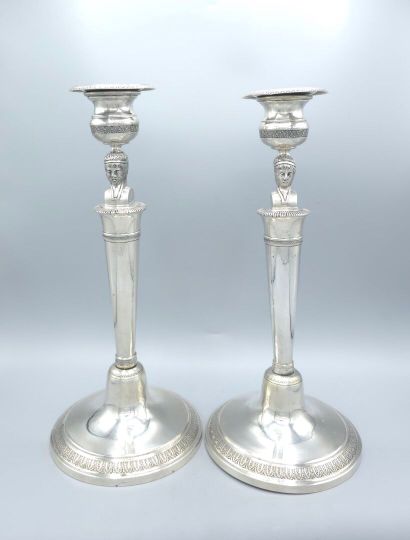 Pair of silver candlesticks.
The shafts adorned...