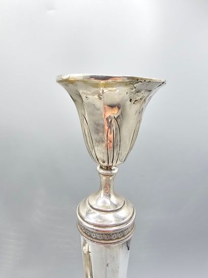 Pair of silver candlesticks.
The upper part...