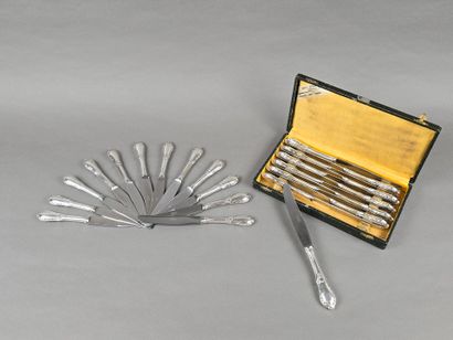 Double set of knives with forged silver handles...