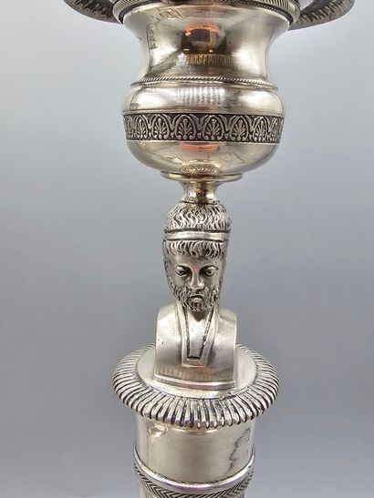 Pair of silver candlesticks.
The shafts adorned...