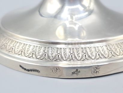 Pair of silver candlesticks.
The shafts adorned...