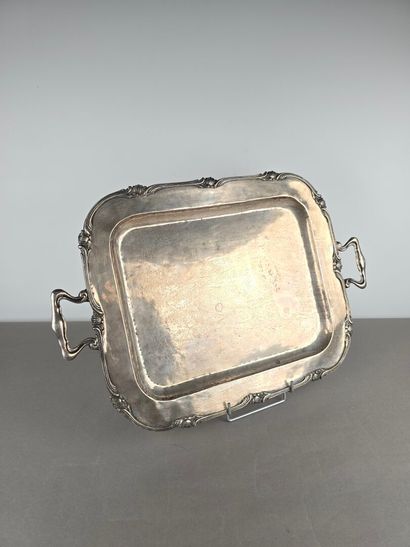 A silver tray with a curved shape.
The wing...