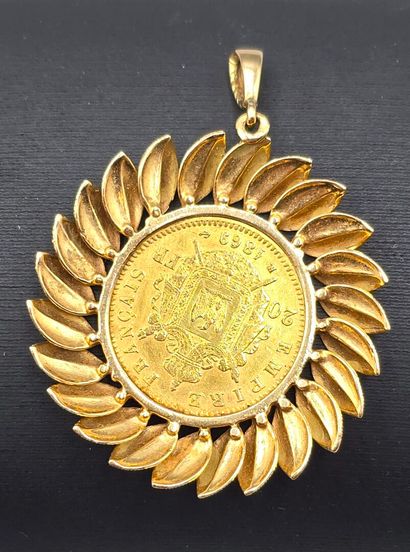 Pièce de 20 francs montée en pendentif.
Pièce...