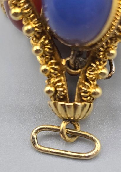 Pendentif breloque en or jaune 750°°.
Il...