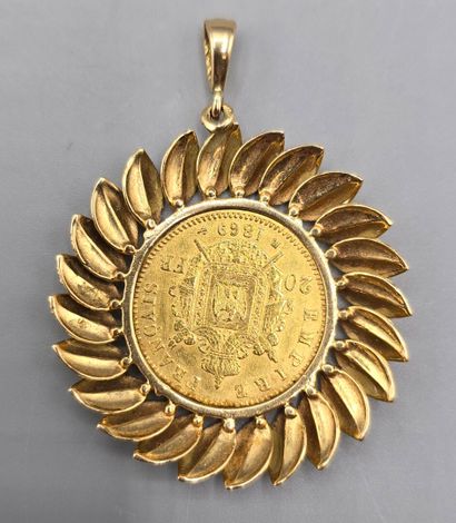 Pièce de 20 francs montée en pendentif.
Pièce...