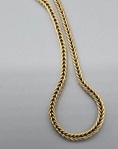 Chaine de montre en or jaune 750°°.
Maille...