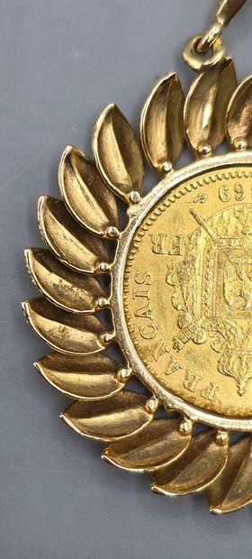 Pièce de 20 francs montée en pendentif.
Pièce...