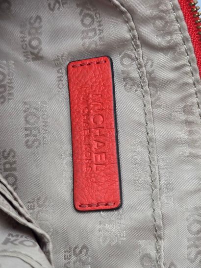 MICHAEL KORS.
Rectangular orange leather...