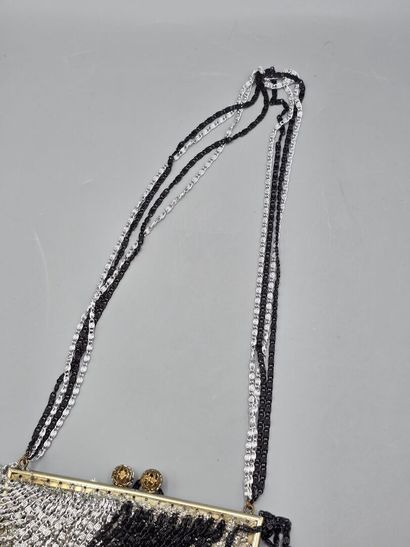 Evening clutch in silver-plated metal set...