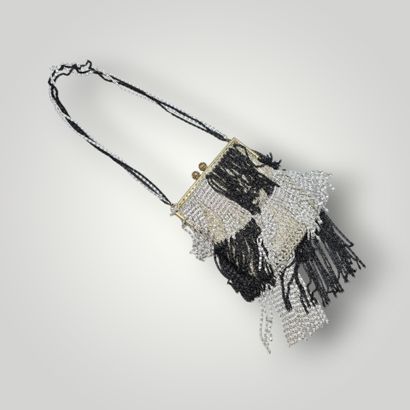 Evening clutch in silver-plated metal set...