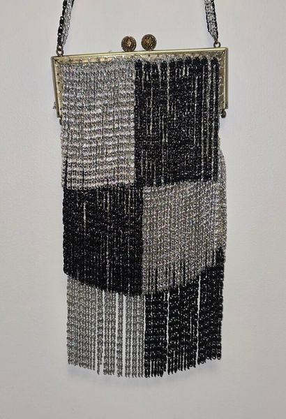 Evening clutch in silver-plated metal set...