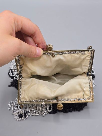 Evening clutch in silver-plated metal set...