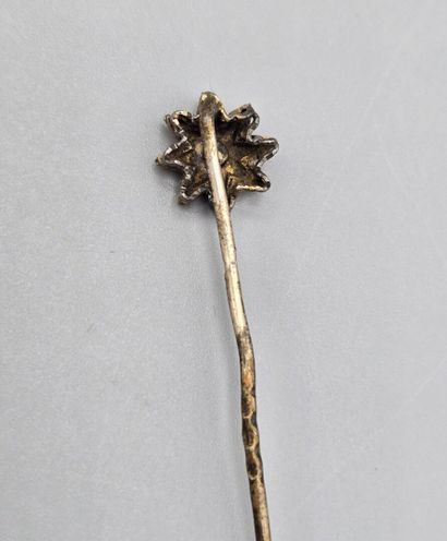 Set of three tie pins: 
- gilt metal tie...