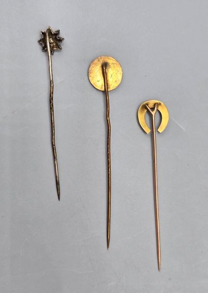 Set of three tie pins: 
- gilt metal tie...